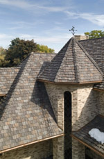 home with cylindrical column and gray shingles