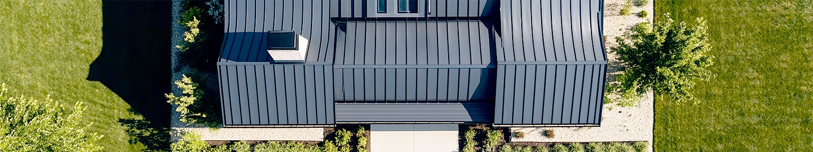 Energy-efficient metal roofing installed on residential property in Travis County