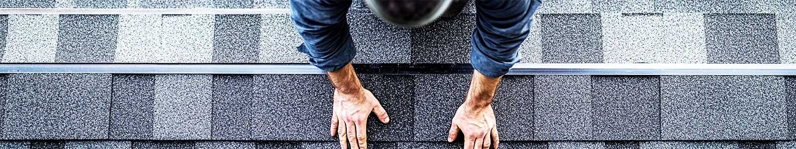 Roofing professional installing impact-resistant shingles on steep-pitch Austin roof